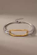 DropIQ two-tone bracelet with a gold oval link on a slim silver band