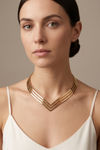 Triple-band V-shaped torque collar in gold worn on the neck